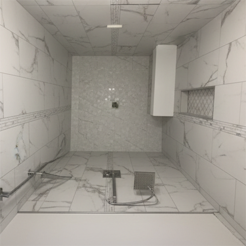 Luxury bathroom quartz shower surround with recessed niche