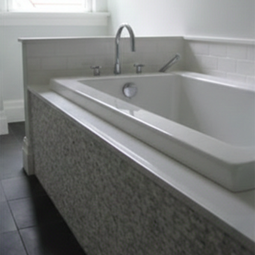 Durable integrated granite tub surround for long-lasting use