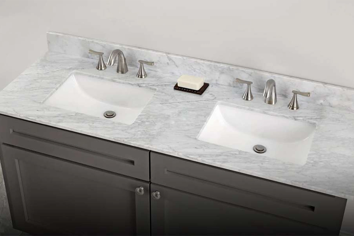 Modern dual-basin vanity surface featuring two integrated rectangular sinks and a spacious central countertop